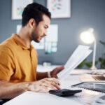 Man calculating price of a project